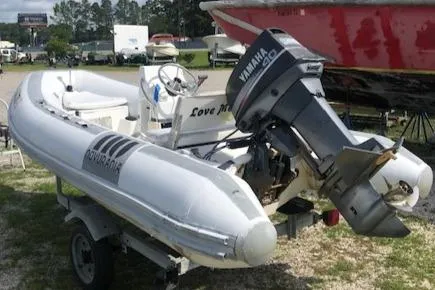 Slide: The Image of 1995 Novurania Tender boat with Yamaha outboard motor on trailer. - 5