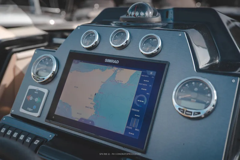Slide: The Image of Dashboard of 2025 SPX RIB 32 Dinette with navigation system and gauges. - 19