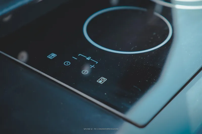 Slide: The Image of Modern induction cooktop on SPX RIB 32 Dinette, 2025 model. - 22