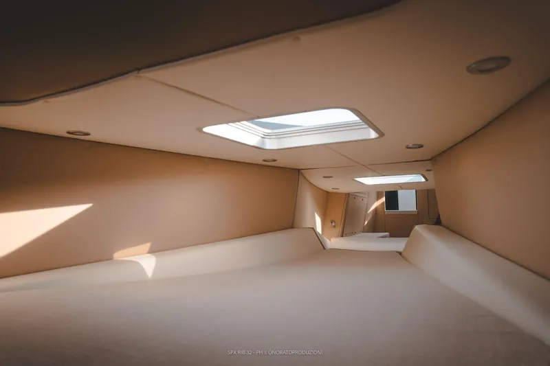 Slide: The Image of Interior cabin of 2025 SPX RIB 32 Sport boat with skylights. - 33