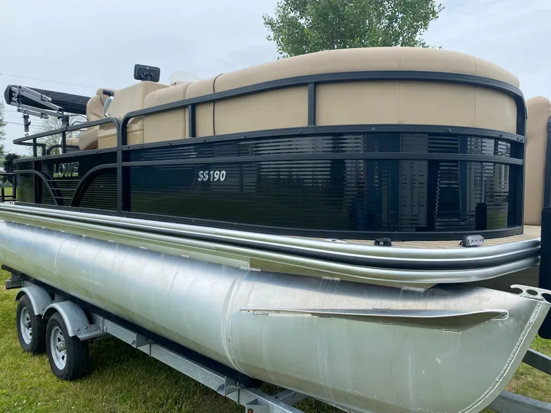 Slide: The Image of 2020 Lowe SS 190 Pontoon boat on a trailer. - 2
