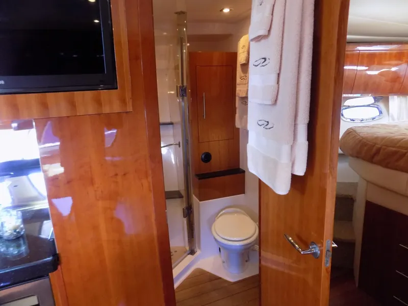 Slide: The Image of Luxurious bathroom interior of 2012 Regal 52 Sport Coupe yacht with wood finish. - 11