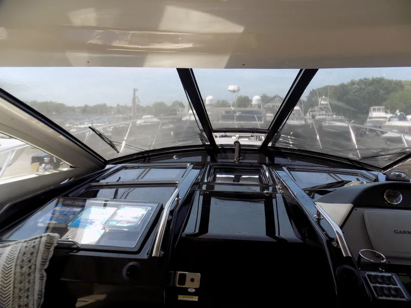 Slide: The Image of Interior view of 2012 Regal 52 Sport Coupe yacht cockpit with navigation controls. - 7