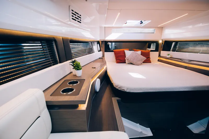 Slide: The Image of Luxurious interior cabin of 2024 Wellcraft 355 yacht with modern design and cozy bed. - 5