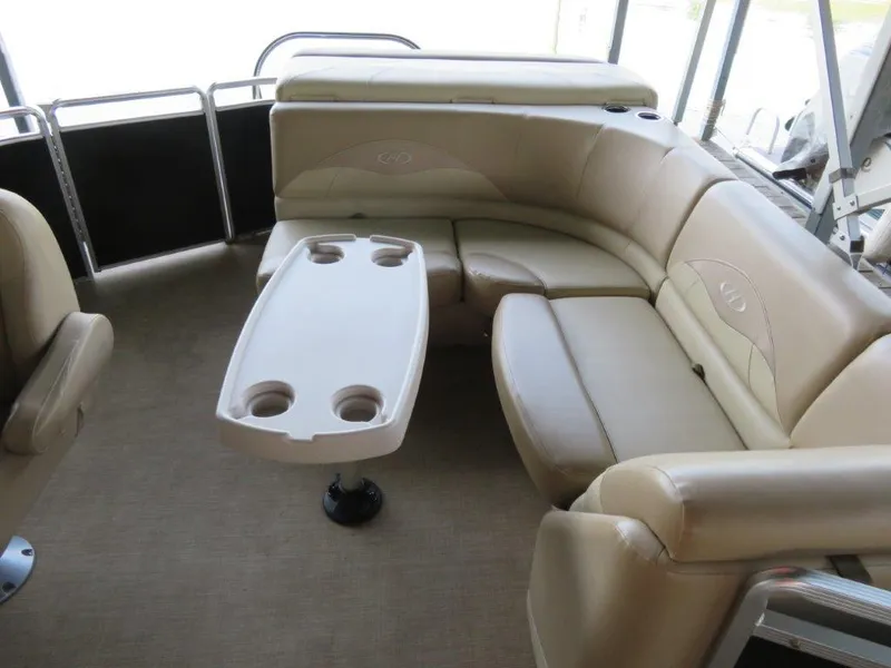 Slide: The Image of 2016 Harris FloteBote Cruisers CX200 interior with beige seating and table. - 3