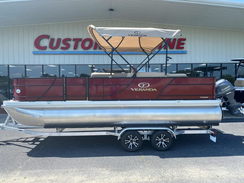 The Image of 2023 Veranda Fish VF20F4 pontoon boat displayed outside dealership. - 1