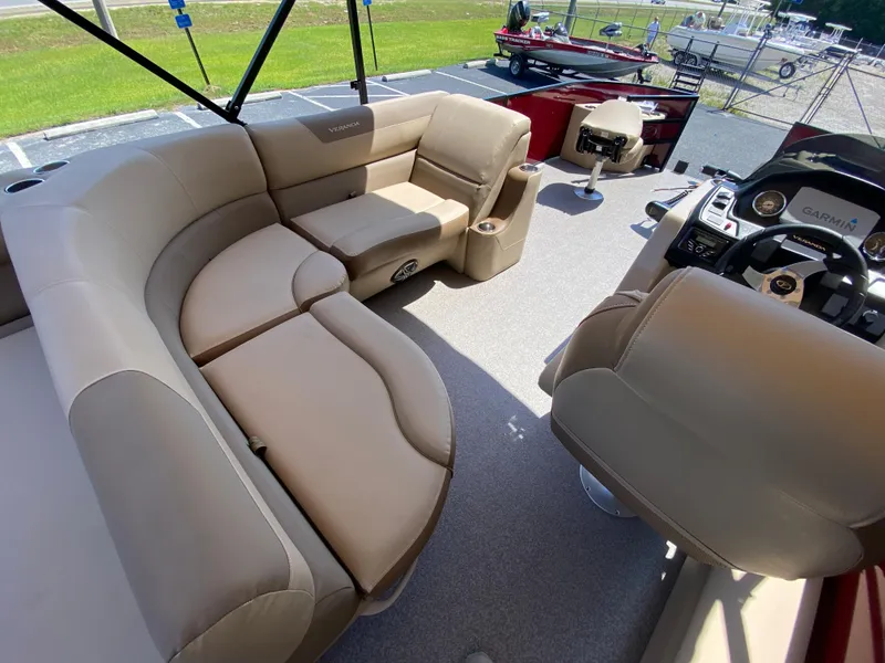 Slide: The Image of 2023 Veranda Fish VF20F4 pontoon boat interior with beige seating and modern helm. - 14