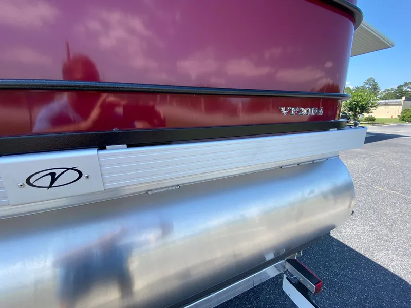 Slide: The Image of 2023 Veranda Fish VF20F4 pontoon boat rear view with red exterior and logo. - 21