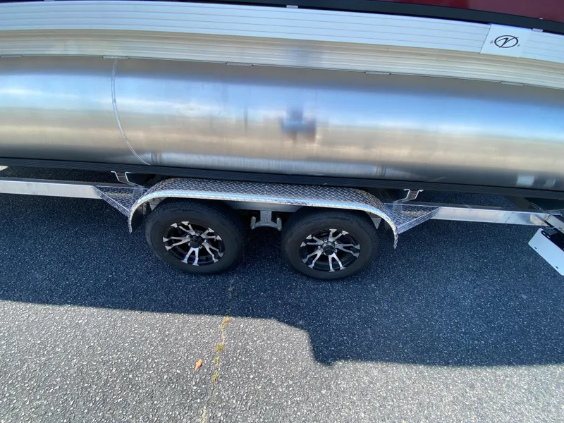 Slide: The Image of 2023 Veranda Fish VF20F4 pontoon boat on a dual-axle trailer. - 22