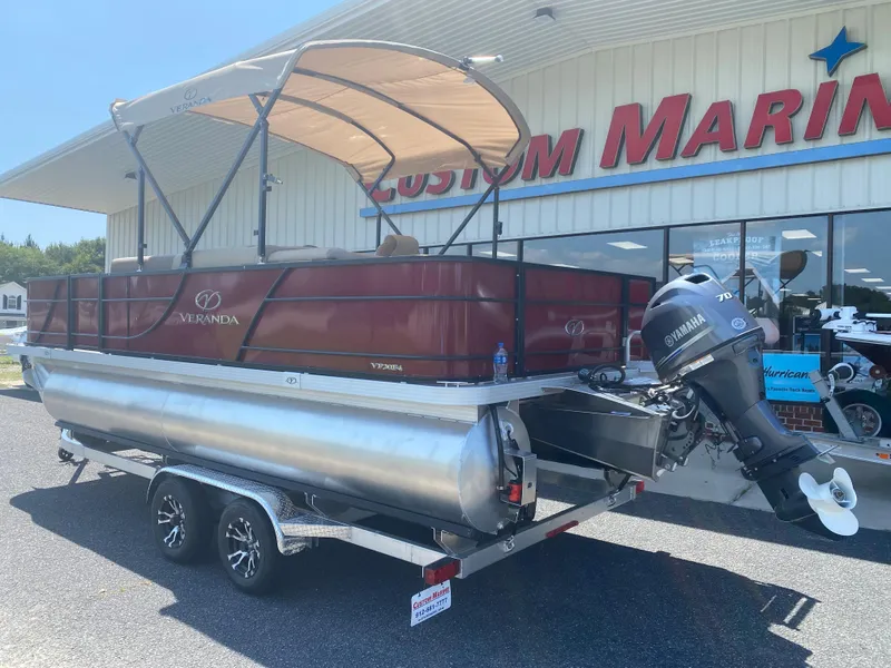 Slide: The Image of 2023 Veranda Fish VF20F4 pontoon boat outside Custom Marine dealership. - 3