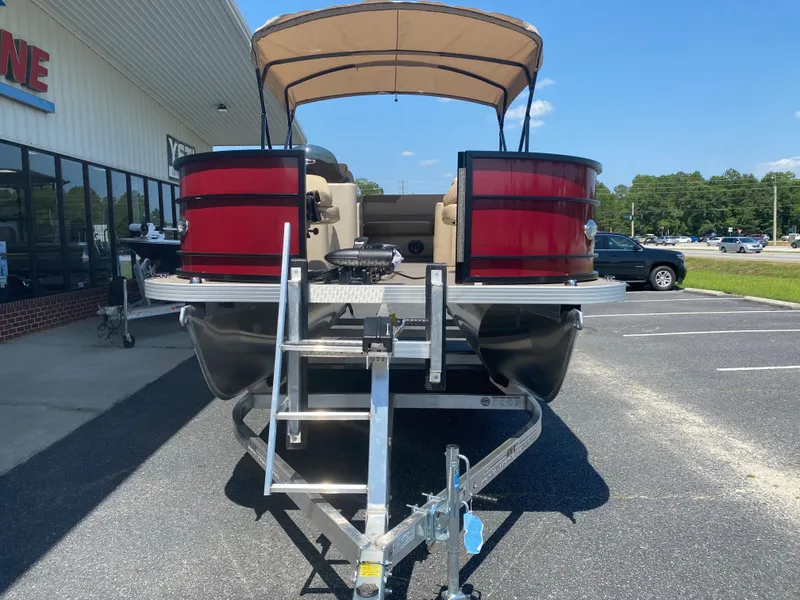 Slide: The Image of 2023 Veranda Fish VF20F4 pontoon boat on a trailer in a parking lot. - 5