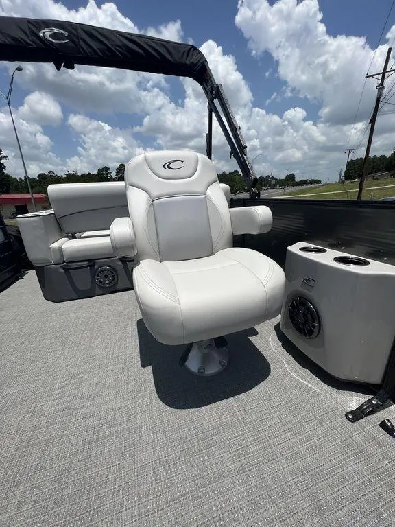 Slide: The Image of 2022 Crest Classic DLX 240 SLSC boat with luxurious seating and modern amenities. - 10