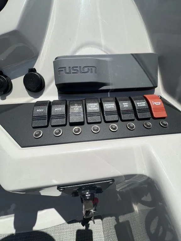 Slide: The Image of Control panel of 2022 Crest Classic DLX 240 SLSC boat with Fusion audio system. - 14