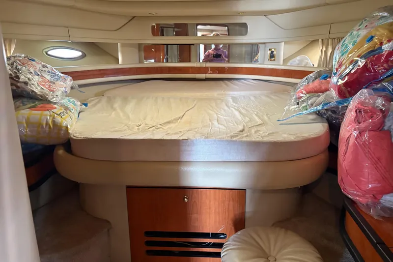 Slide: The Image of Cozy cabin interior of 2000 Sea Ray 460 Sundancer yacht with bed and storage. - 55
