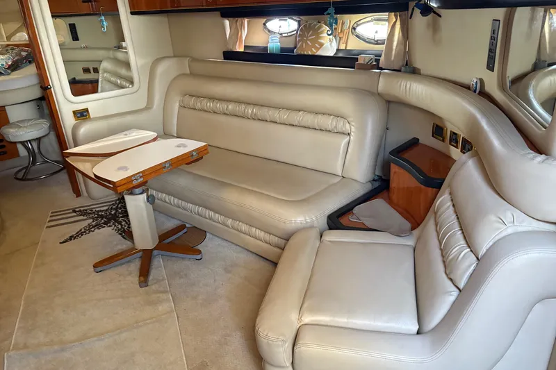 Slide: The Image of Luxurious interior of a 2000 Sea Ray 460 Sundancer yacht with beige leather seating. - 57