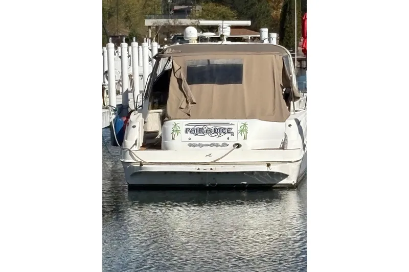 Slide: The Image of 2000 Sea Ray 460 Sundancer yacht docked at marina, rear view. - 59