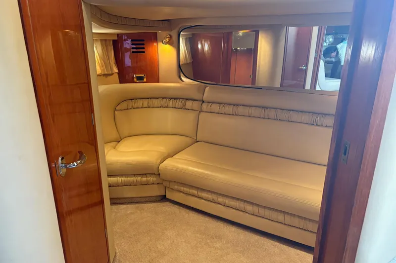 Slide: The Image of Luxurious interior of 2000 Sea Ray 460 Sundancer yacht with beige leather seating. - 65