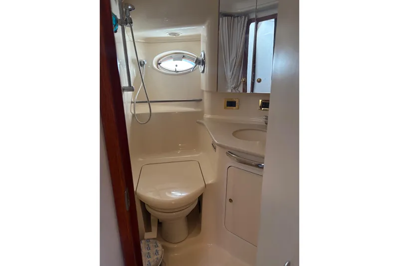 Slide: The Image of Bathroom interior of 2000 Sea Ray 460 Sundancer yacht, featuring shower and sink. - 67
