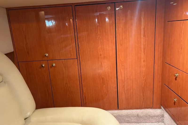 Slide: The Image of Luxurious wooden cabinetry inside a 2000 Sea Ray 460 Sundancer yacht interior. - 69