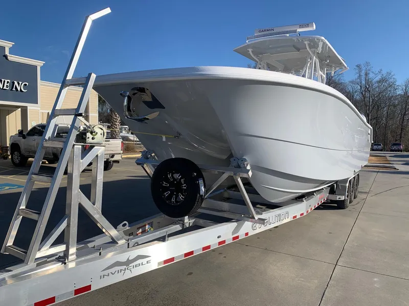 Slide: The Image of 2024 Invincible 33 Catamaran on trailer, ready for transport. - 3