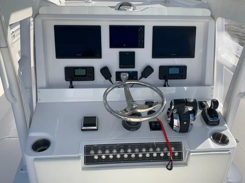 Slide: The Image of 2024 Invincible 33 Catamaran helm with advanced navigation and control systems. - 4