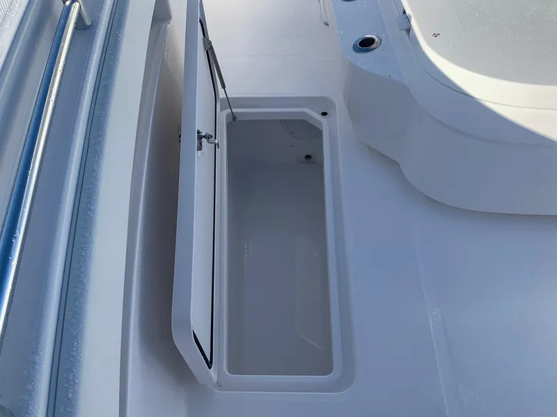 Slide: The Image of 2024 Invincible 33 Catamaran storage compartment with open hatch. - 17