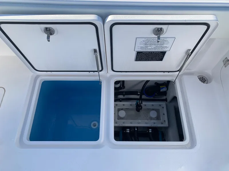 Slide: The Image of 2024 Invincible 33 Catamaran storage compartments and livewell. - 7