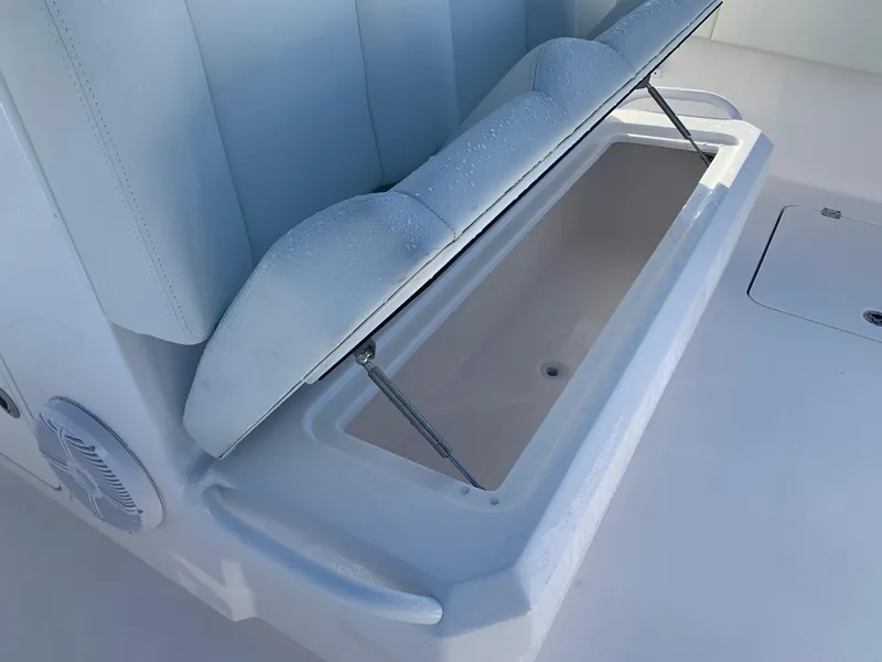 Slide: The Image of 2024 Invincible 33 Catamaran storage compartment under cushioned seat. - 8