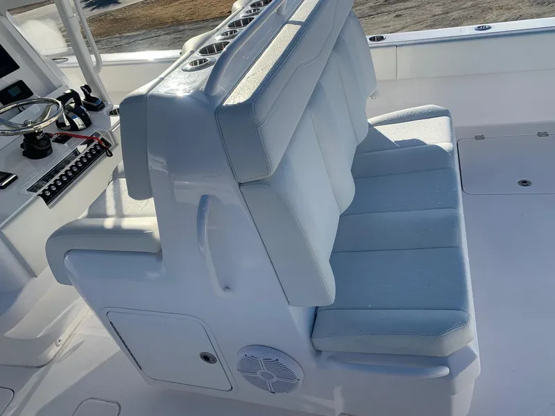 Slide: The Image of 2024 Invincible 33 Catamaran cockpit seating and helm station. - 9