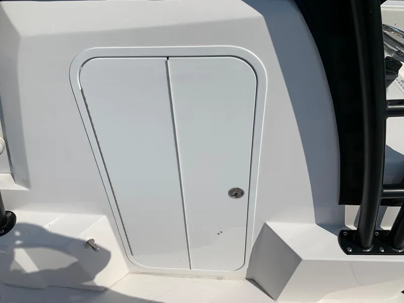 Slide: The Image of 2024 Invincible 35 Catamaran storage compartment door. - 18