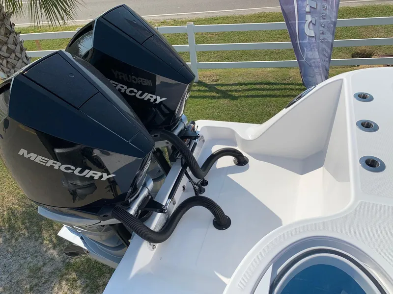 Slide: The Image of 2024 Invincible 35 Catamaran with twin Mercury outboard engines. - 24