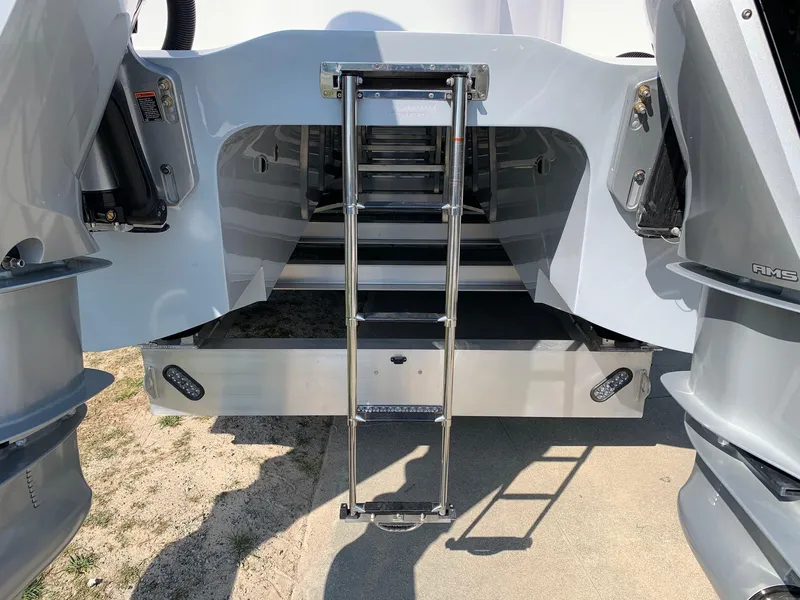 Slide: The Image of 2024 Invincible 35 Catamaran rear view with ladder and twin engines. - 25
