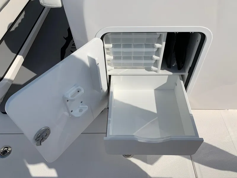 Slide: The Image of Open storage compartment on 2024 Invincible 35 Catamaran boat. - 12