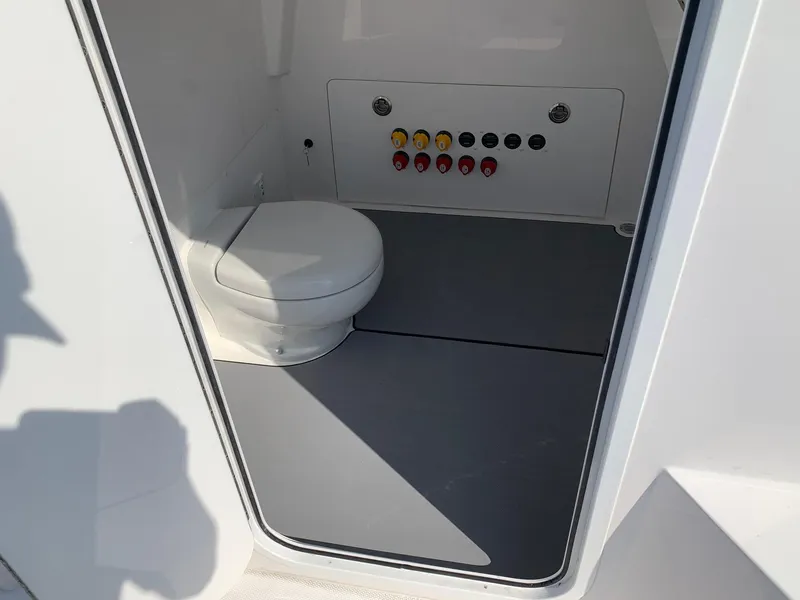 Slide: The Image of 2024 Invincible 35 Catamaran interior bathroom with control panel. - 17