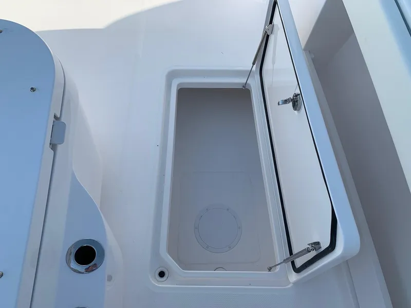 Slide: The Image of Open storage compartment on 2024 Invincible 35 Catamaran boat. - 19