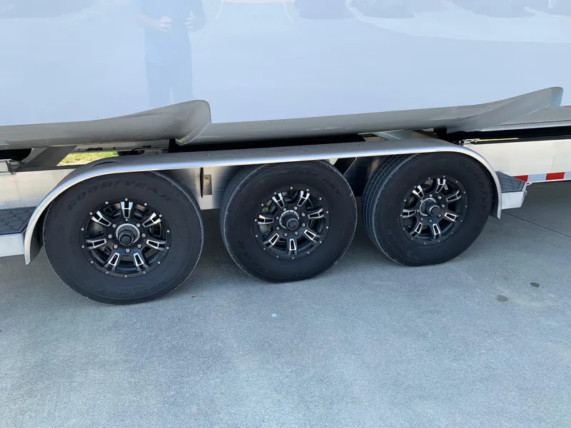 Slide: The Image of 2024 Invincible 35 Catamaran on a triple-axle trailer. - 26