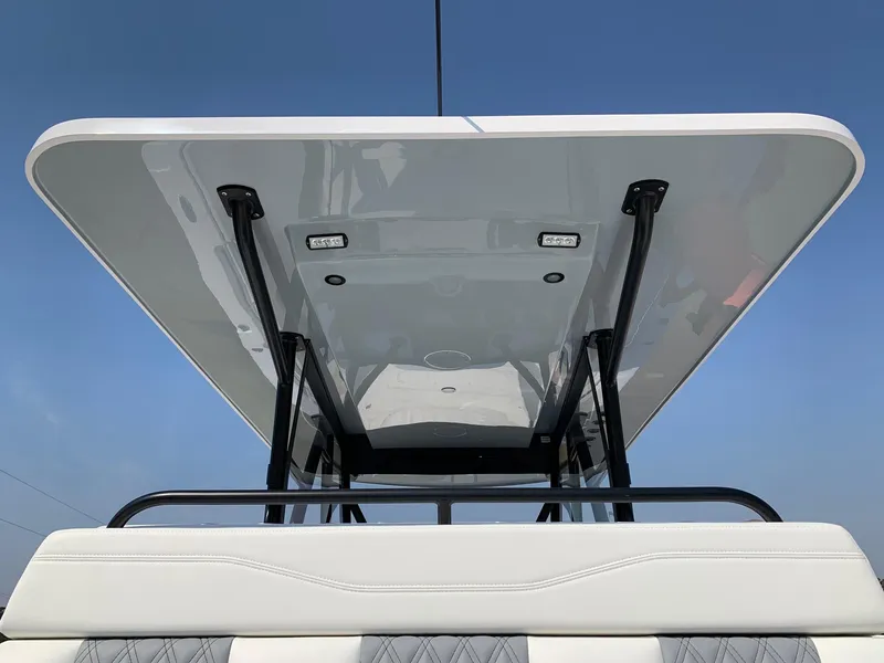 Slide: The Image of 2024 Invincible 35 Catamaran T-top with integrated lights and sleek design. - 6