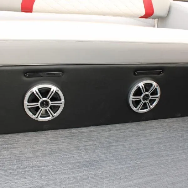 Slide: The Image of 2023 Lowe SS210 W Super Sport boat interior with dual speakers and cushioned seating. - 10