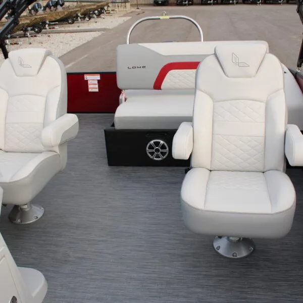 Slide: The Image of 2023 Lowe SS210 W Super Sport boat interior with white cushioned seats. - 11