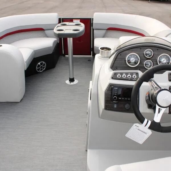 Slide: The Image of 2023 Lowe SS210 W Super Sport boat interior with steering console and seating area. - 14