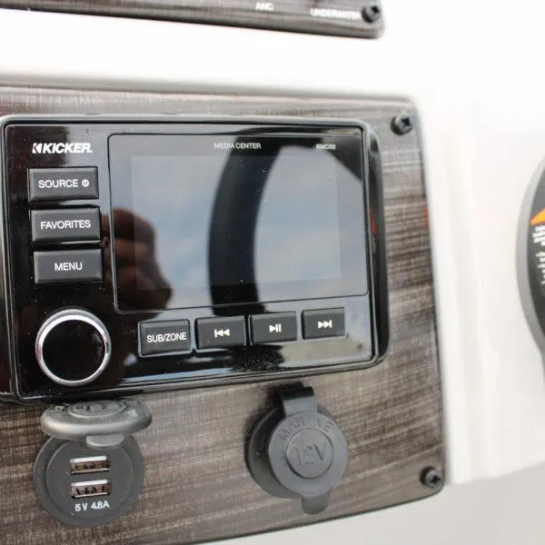 Slide: The Image of 2023 Lowe SS210 W Super Sport boat media center and USB ports. - 15