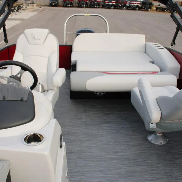 Slide: The Image of 2023 Lowe SS210 W Super Sport boat interior with white seating and steering console. - 7
