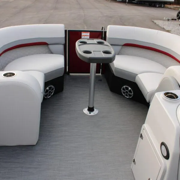 Slide: The Image of 2023 Lowe SS210 W Super Sport boat interior with seating and table. - 9
