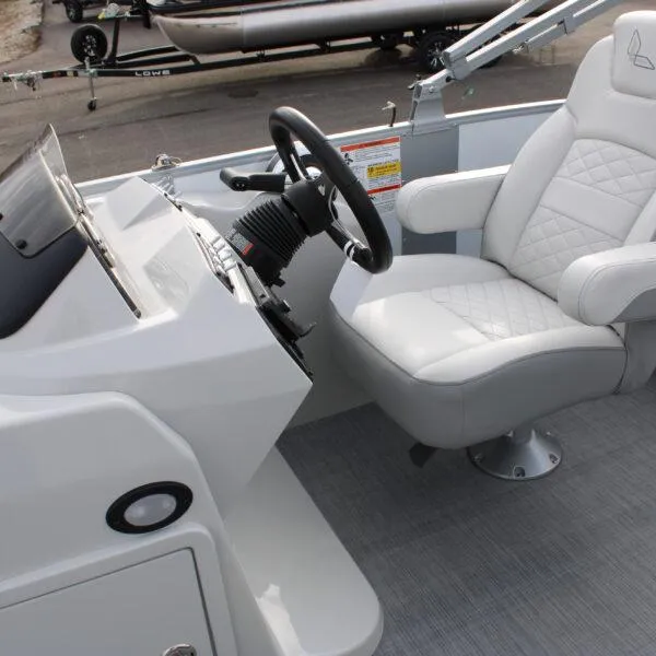 Slide: The Image of 2023 Lowe SF212W boat helm with white captain's chair and steering wheel. - 4