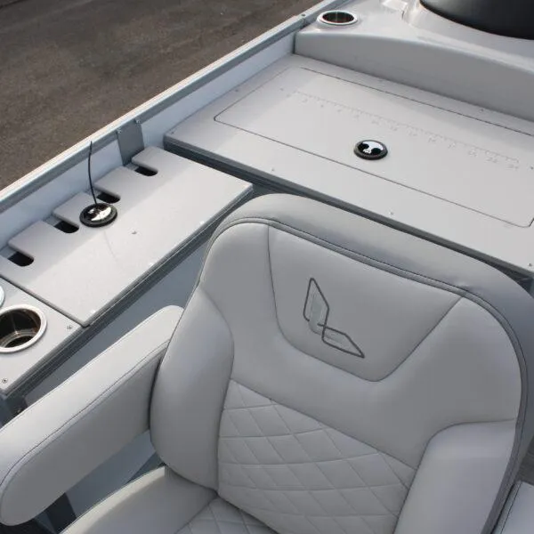 Slide: The Image of 2023 Lowe SF212W boat interior with cushioned seat and fishing rod holders. - 5
