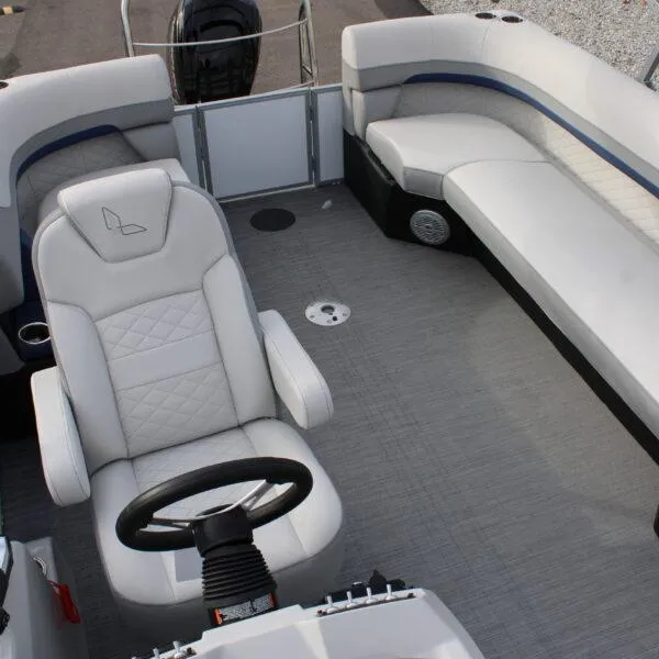 Slide: The Image of 2023 Lowe SF212W boat interior with white seating and steering console. - 7