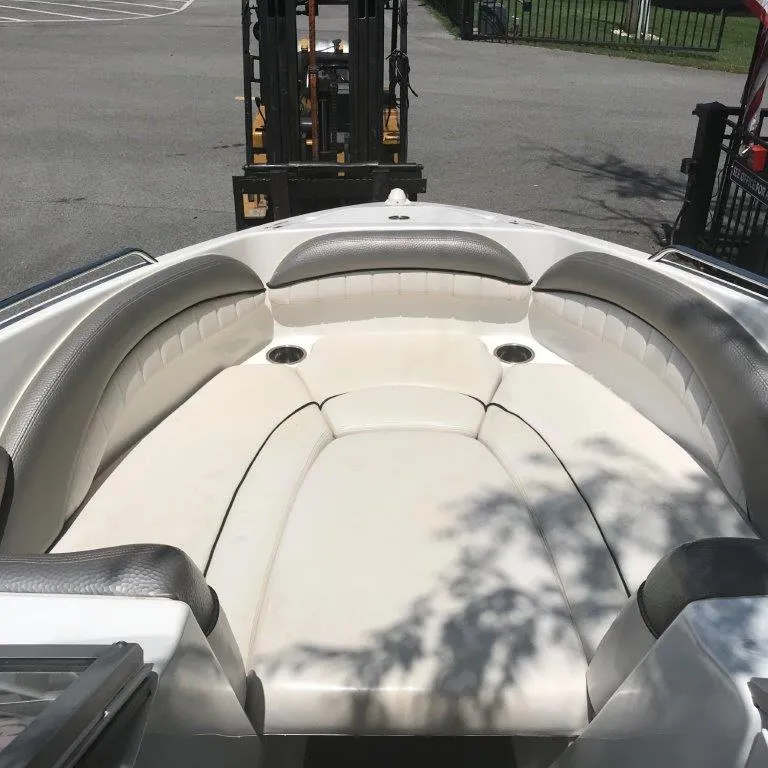 Slide: The Image of 2007 Yamaha Boats AR 230 bow seating area with white and gray upholstery. - 3