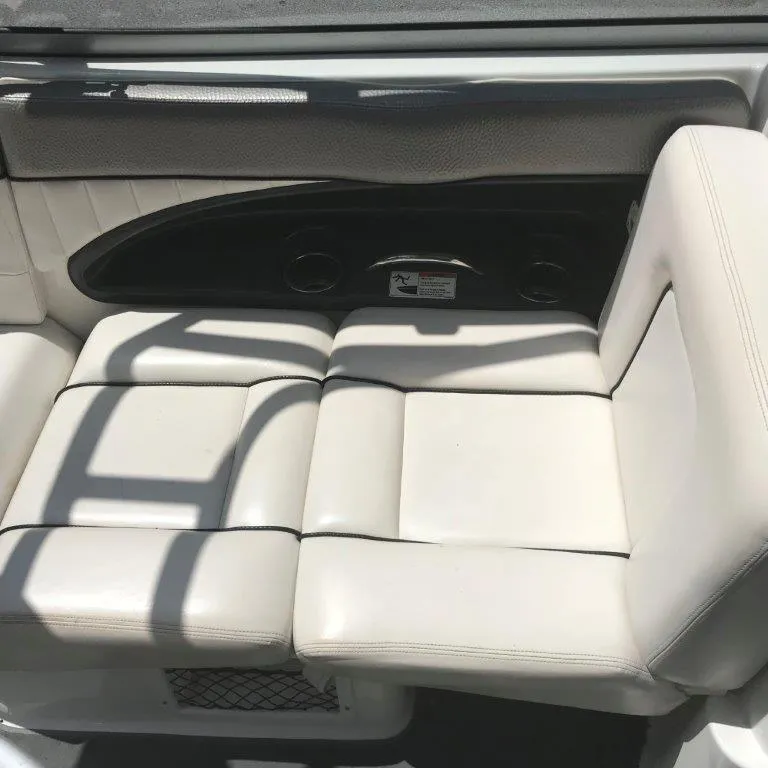 Slide: The Image of 2007 Yamaha Boats AR 230 interior seating with white upholstery. - 8