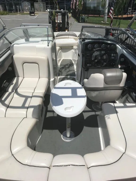 Slide: The Image of 2007 Yamaha Boats AR230 HO interior with seating and steering console. - 11