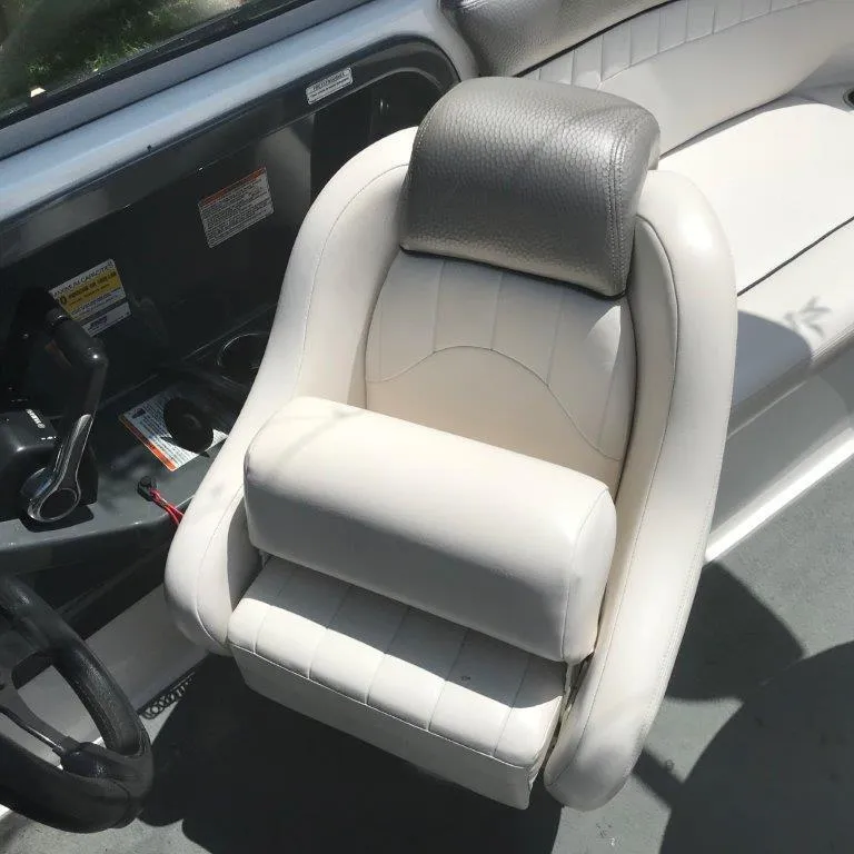 Slide: The Image of 2007 Yamaha AR230 HO boat interior with white captain's seat and steering wheel. - 5